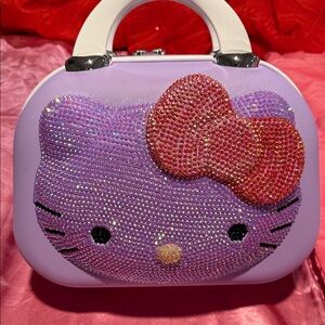 Hello Kitty Sparkling Purple makeup/travel Bag with red Bow